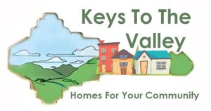 Keys to the Valley graphic with key cutout showing sky, grass and buildings - Homes for your community
